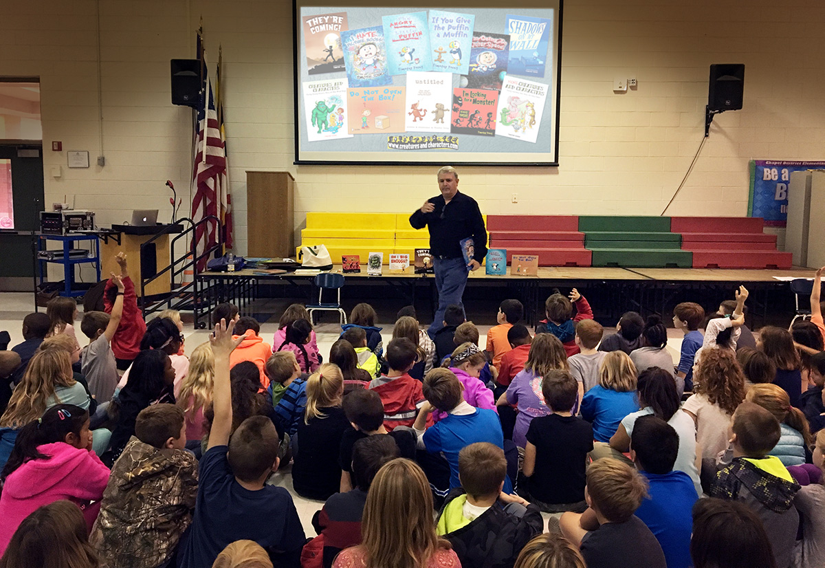 Author/illustrator Timothy Young presents to a group of elementary school students.